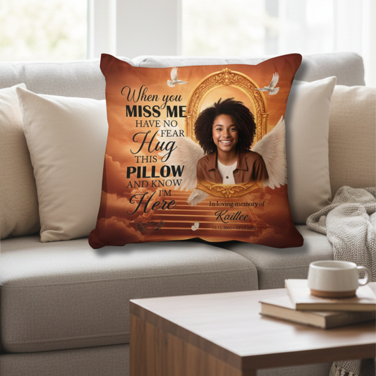 Decorative pillow with a printed design of a woman with angel wings on a couch. Decorative pillow with a printed design of a woman with angel wings on a couch.