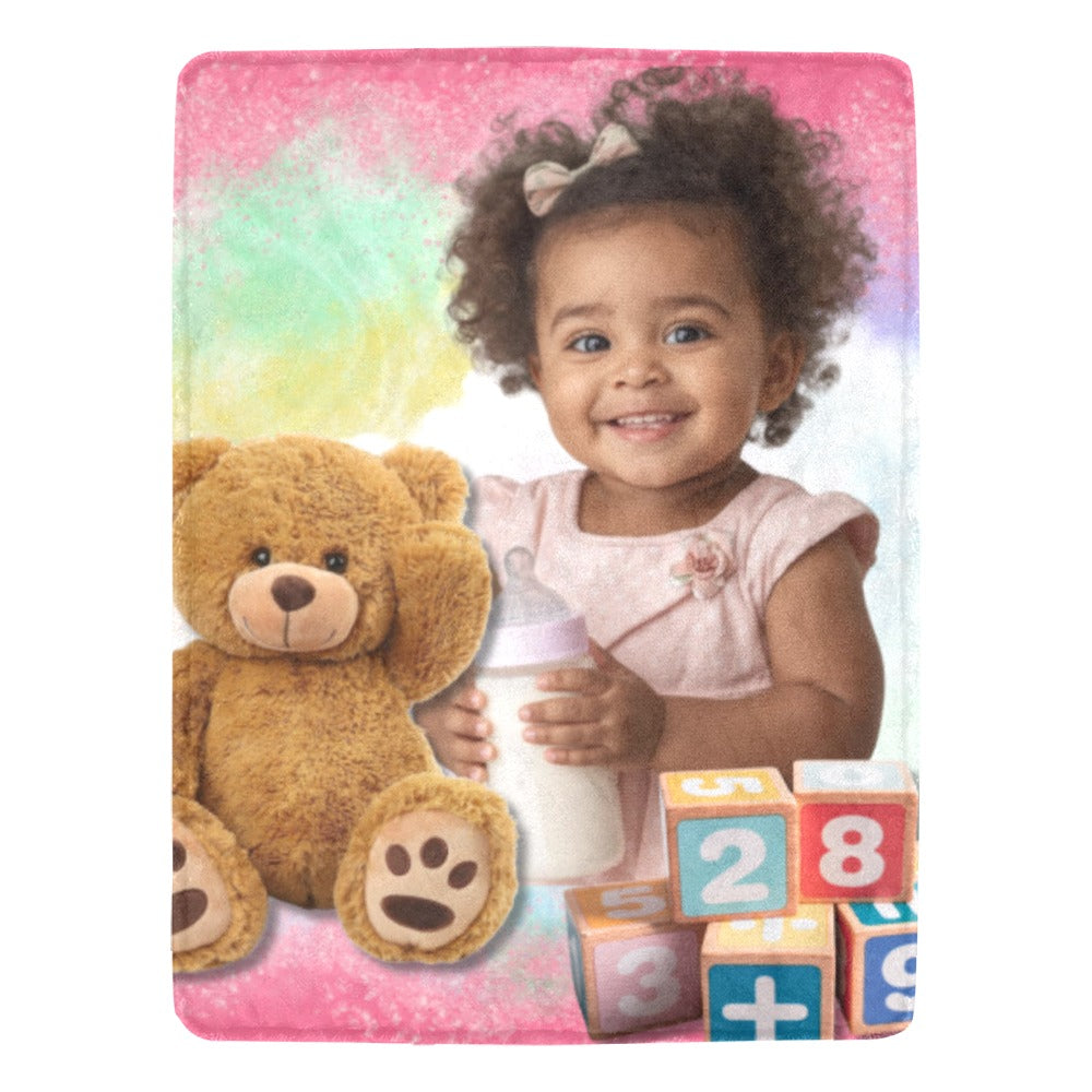 Child holding a bottle with a teddy bear and blocks on a colorful background